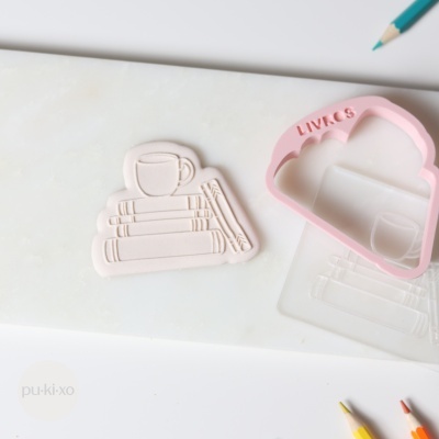 Carimbo + cortador livros e café