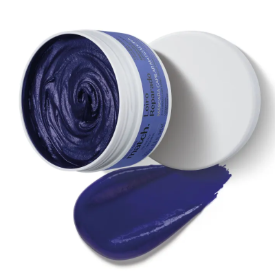 Pote aberto de máscara capilar azul escuro com tampa branca ao lado