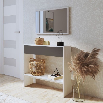 Aparador em madeira clara com gaveta cinzenta, decorado, junto a porta branca e vaso com plantas secas