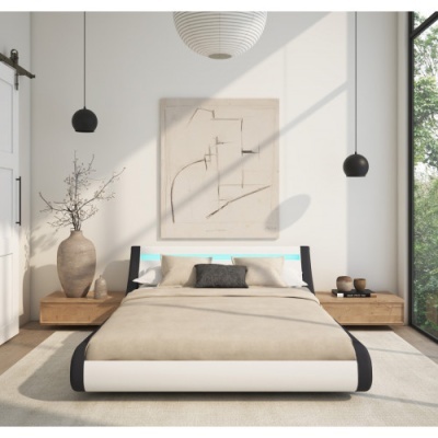 Quarto minimalista com cama preta e branca e decoração neutra