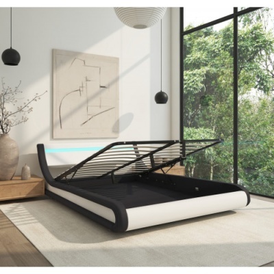 Cama preta e branca com base elevatória num quarto moderno