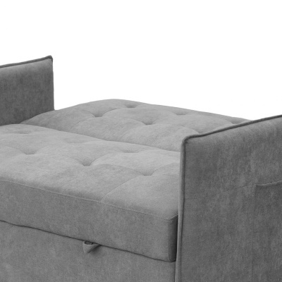 Poltrona-cama cinza de tecido com botões capitonê e braços retos