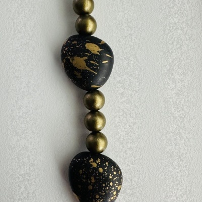 ✨ Colar Preto Dourado – Sofisticação e Exclusividade ✨