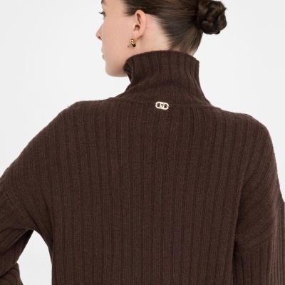 Wool polo-neck with bejewelled buttons