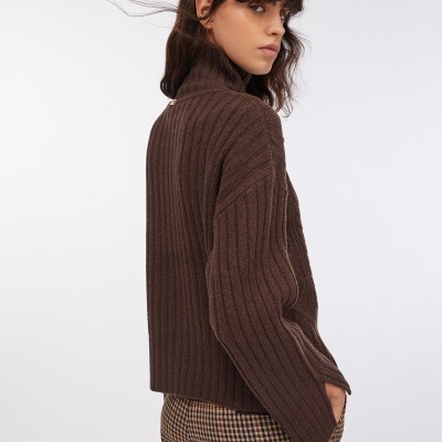 Wool polo-neck with bejewelled buttons