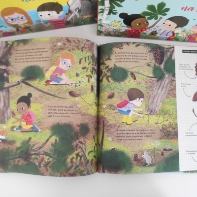 Livro infantil aberto com ilustrações e texto sobre natureza e floresta
