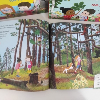 Livro infantil ilustrado com cenas de floresta e crianças