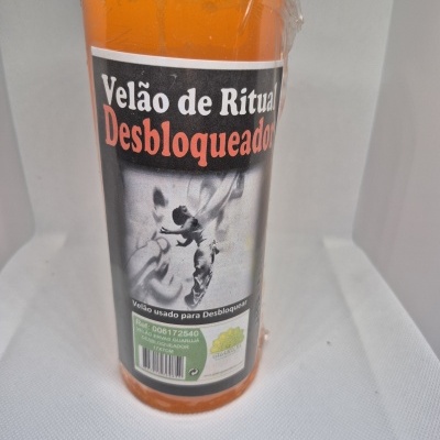 Vela de ritual desbloqueador laranja com etiqueta e embalagem plástica