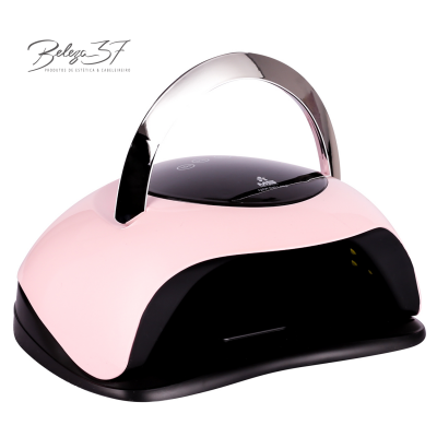 Dispositivo elétrico para beleza rosa e preto com alça prateada