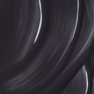 Superfície preta brilhante com padrões curvos e reflexos.