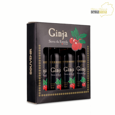 Caixa preta com quatro garrafas de Ginja Serra da Estrela e ilustração de ginjas