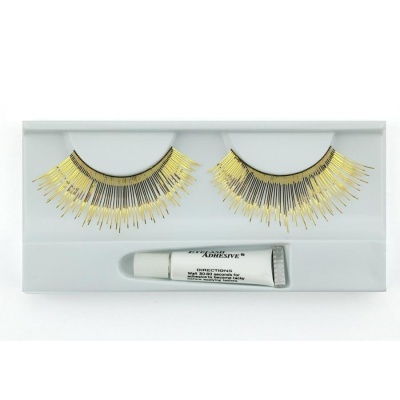 Pestanas postiças pretas e douradas com cola num estojo branco