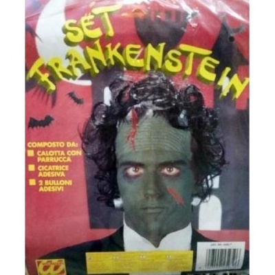 Máscara Frankenstein verde com cicatrizes e peruca negra em embalagem vermelha com texto amarelo.