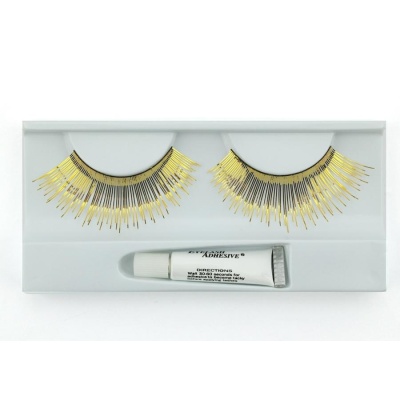 Pestanas postiças pretas e douradas com cola num estojo branco