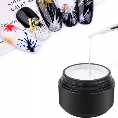 Pote preto de gel branco com pincel e unhas decoradas