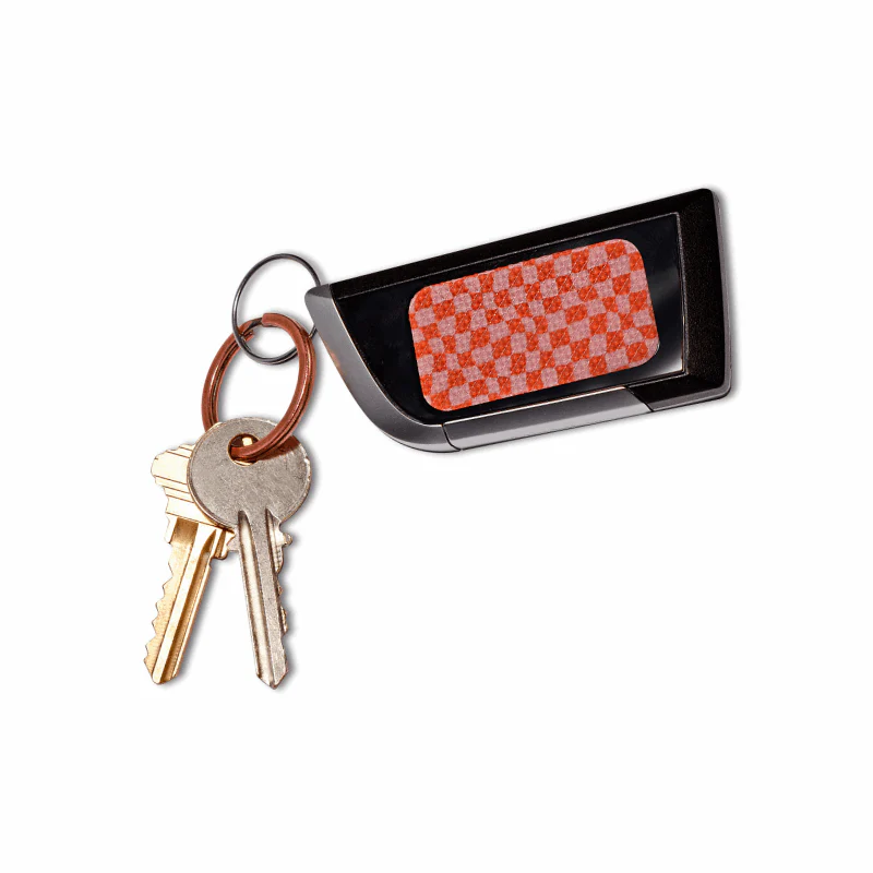 Bandas Fidget ZenStrips Anywhere Rugoso, Pack 13 Chaves metálicas com controlo remoto preto com padrão quadriculado laranja e branco