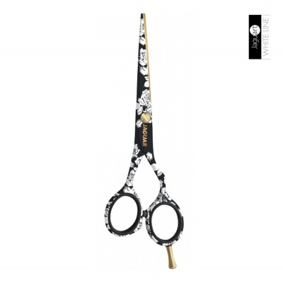 Tesoura de corte preta e branca com padrão floral e lâminas douradas