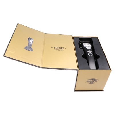 Aparador de cabelo preto em embalagem castanha com texto 'ROCKET HAIR CLIPPER'