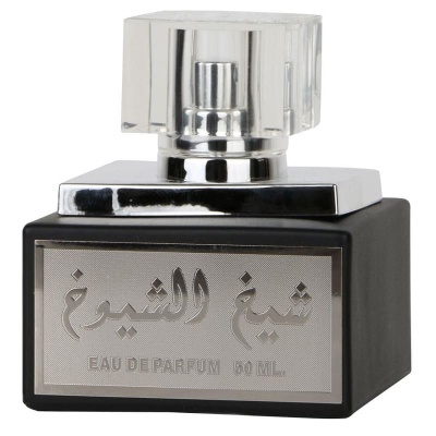 Frasco de perfume preto com tampa transparente e texto em árabe e francês