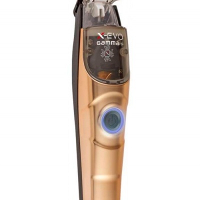 Aparador de cabelo elétrico dourado Gamma X-EVO com botão iluminado.