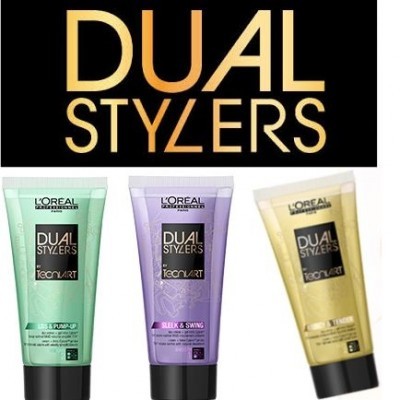 Três tubos de produtos capilares Dual Stylers da L'Oréal em verde, lilás e dourado com tampas pretas