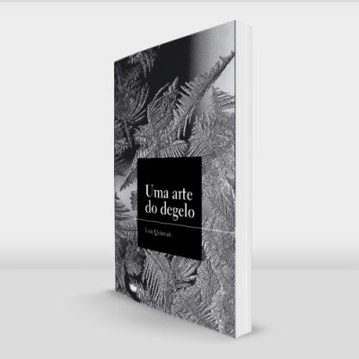 Livro com capa preta e branca decorada com folhas e texto 'Uma arte do céu'