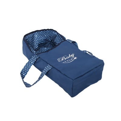 Berço portátil azul escuro para bebé com interior bolinhas brancas.
