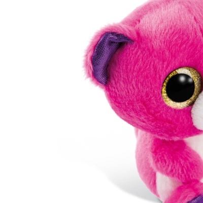 Pelúcia rosa com olhos grandes dourados e preto e orelhas roxas