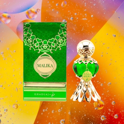 Frasco de perfume verde decorativo ao lado da caixa verde MALIKA KHADLAJ