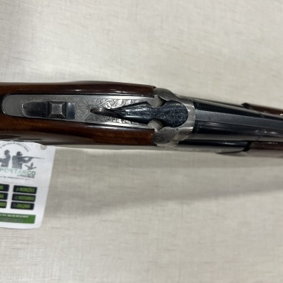 Espingarda de canos duplos com coronha em madeira