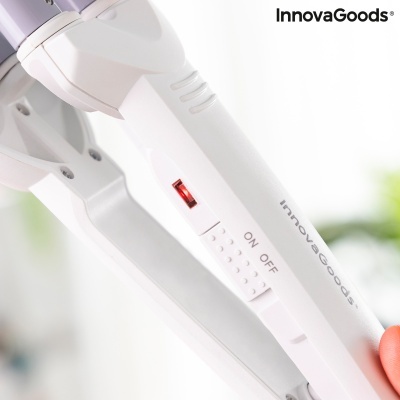 Aparelho branco InnovaGoods com interruptor ON/OFF e luz vermelha, segurado por uma mão