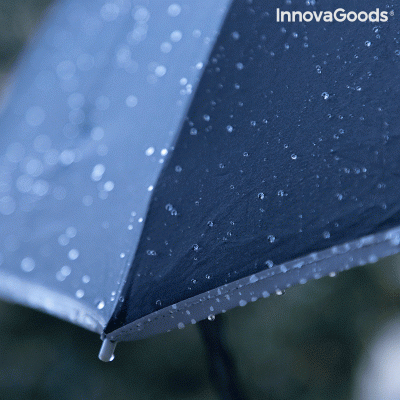 Guarda-chuva preto com gotas de água, texto InnovaGoods no canto superior direito