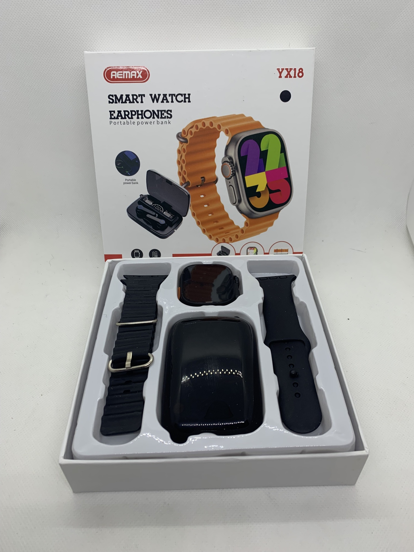 Smartwatch AEMAX YX18 – O Kit Tecnológico Completo com Estilo e Desempenho Conjunto smartwatch Remax YX18 com pulseiras e earphones em embalagem branca