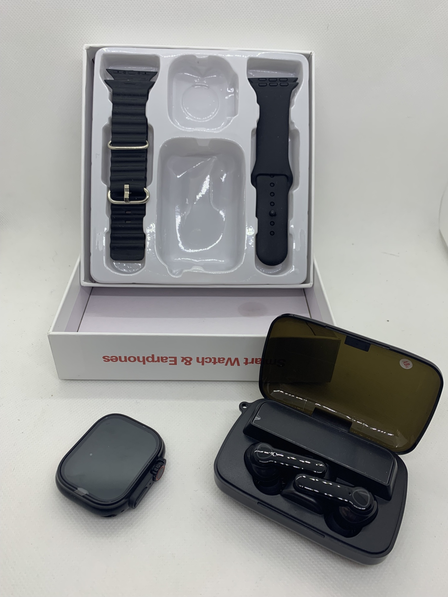 Smartwatch AEMAX YX18 – O Kit Tecnológico Completo com Estilo e Desempenho Conjunto de smartwatch, pulseiras e auriculares Bluetooth pretos