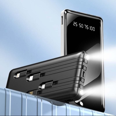 Power bank preto com visor digital e três cabos incorporados sobre caixa azul