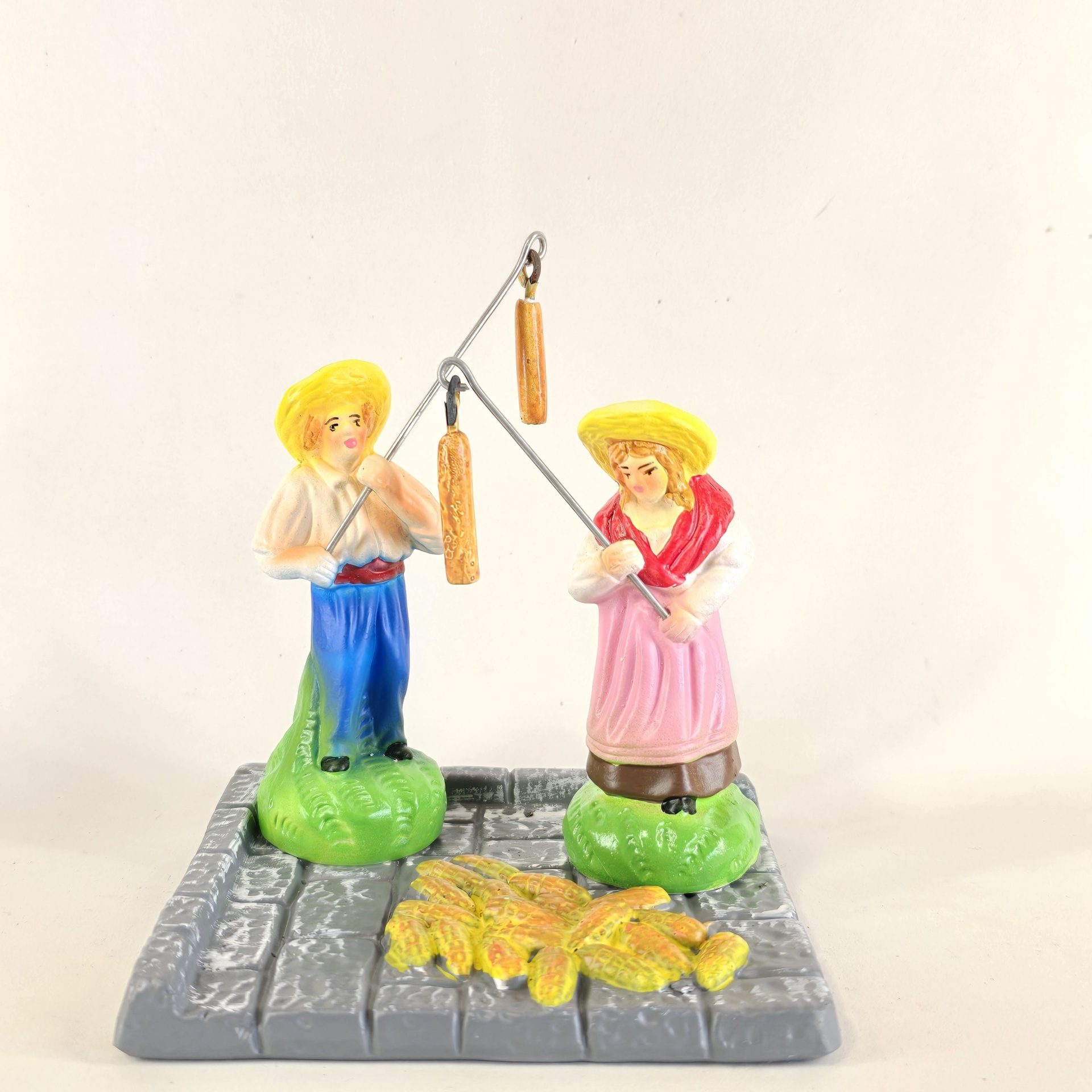 Casal a malhar o milho