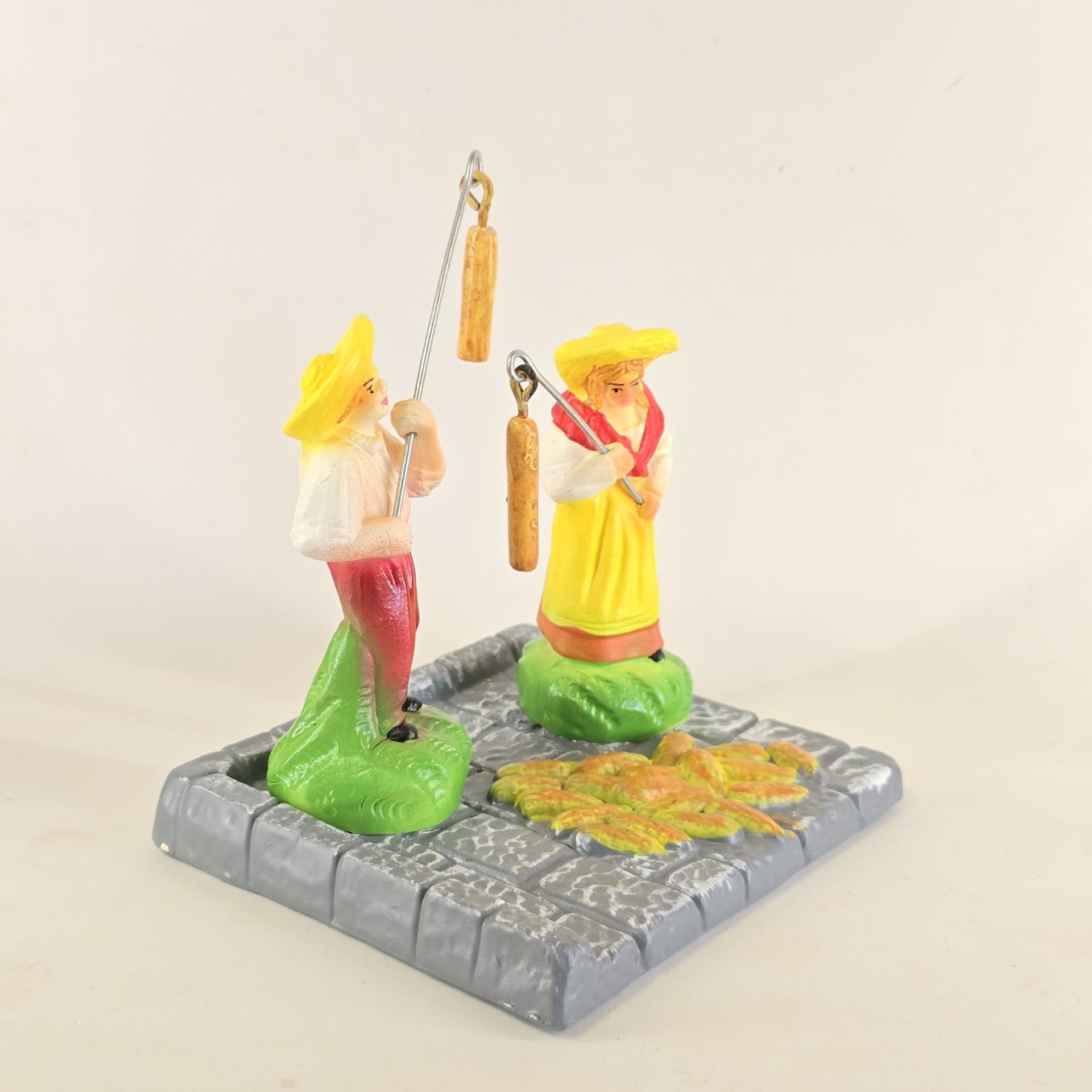 Casal a malhar o milho