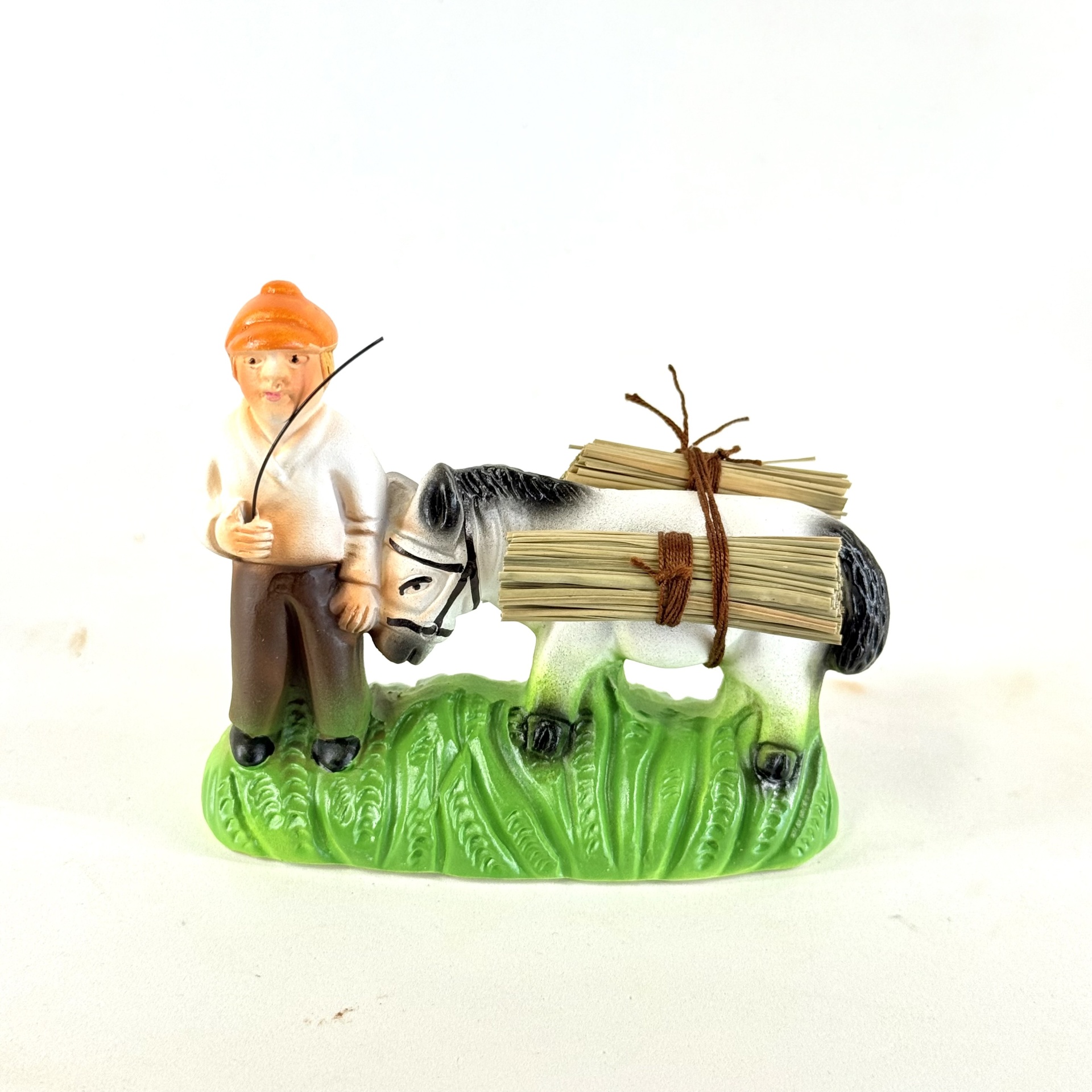 Menino com burro junto (palha)