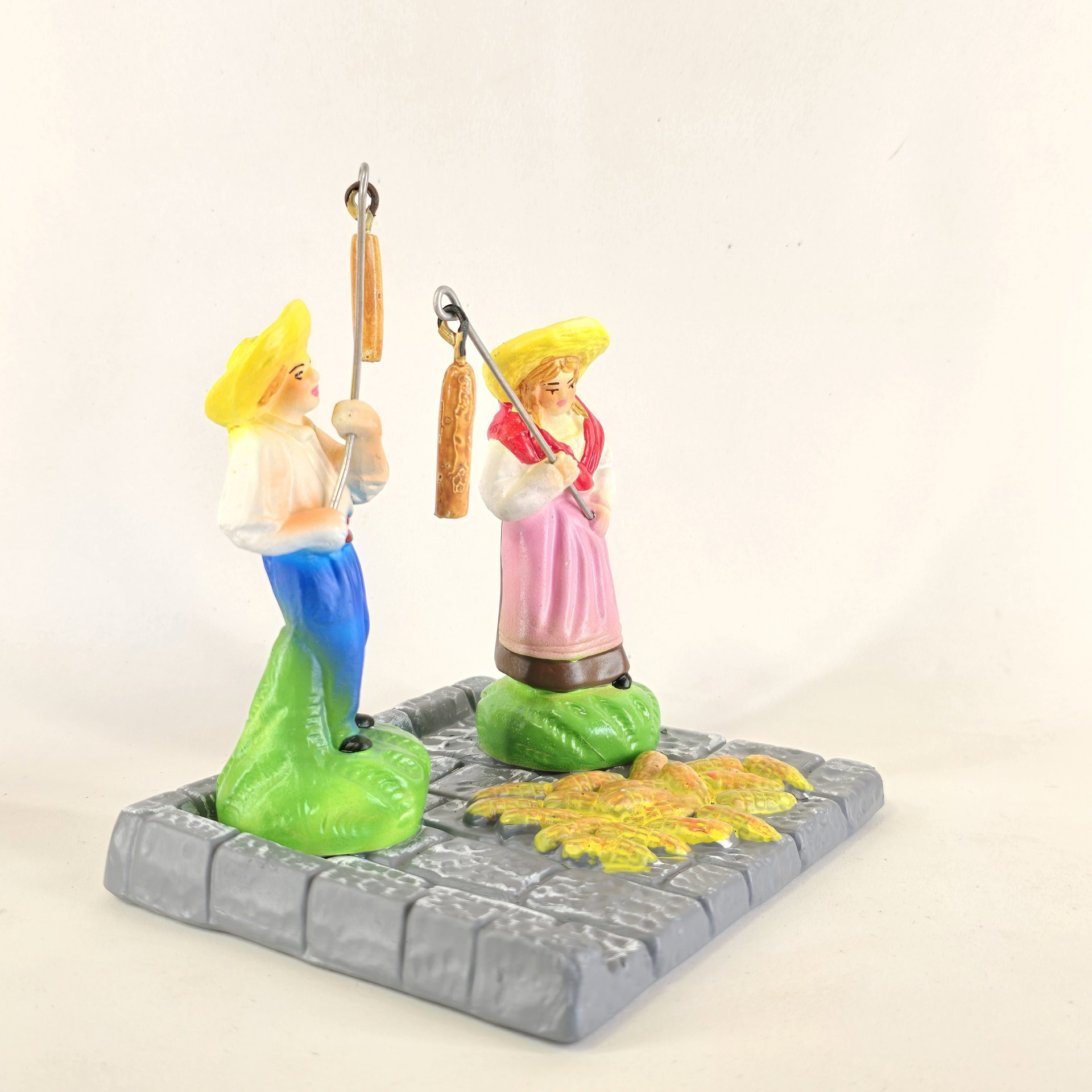 Casal a malhar o milho