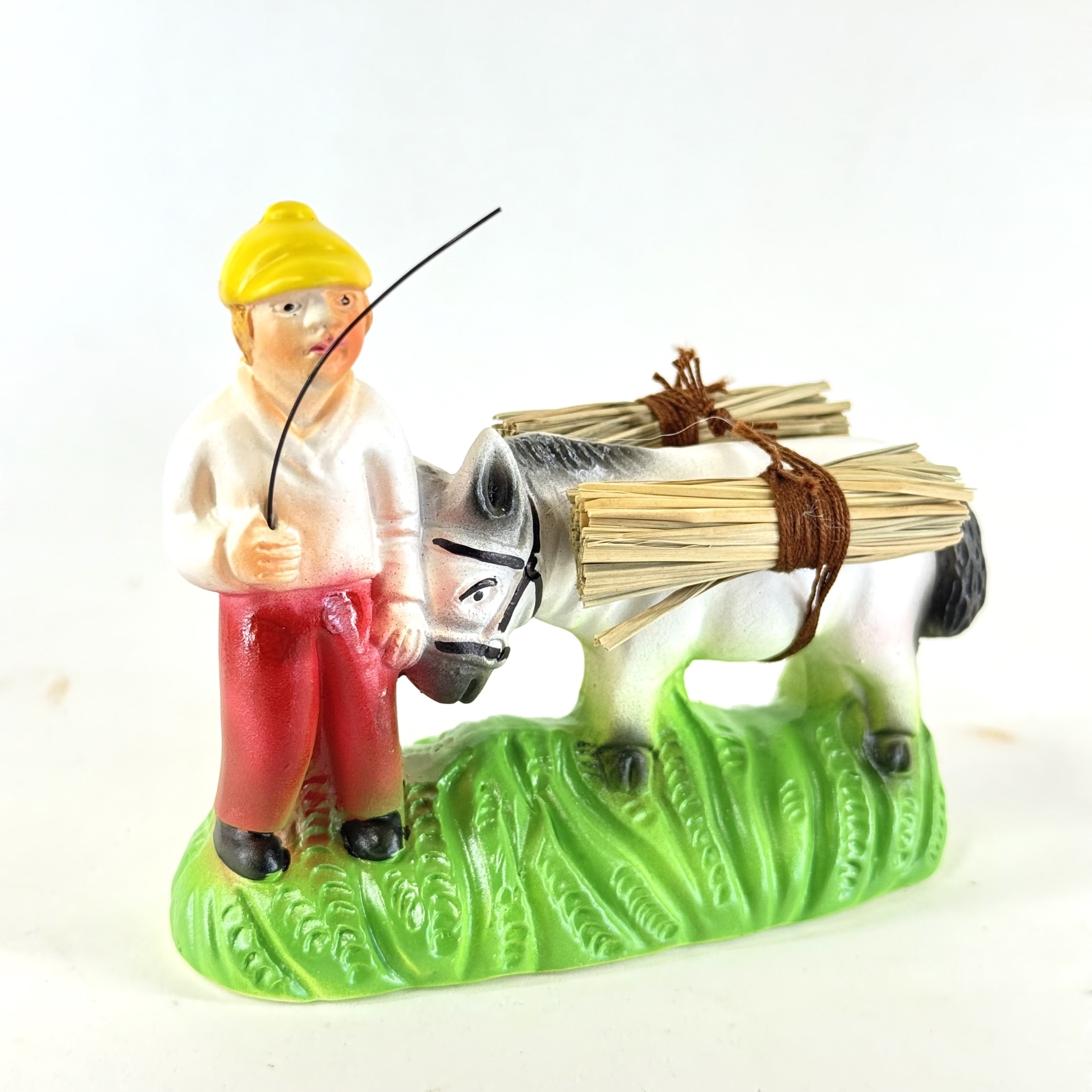 Menino com burro junto (palha)