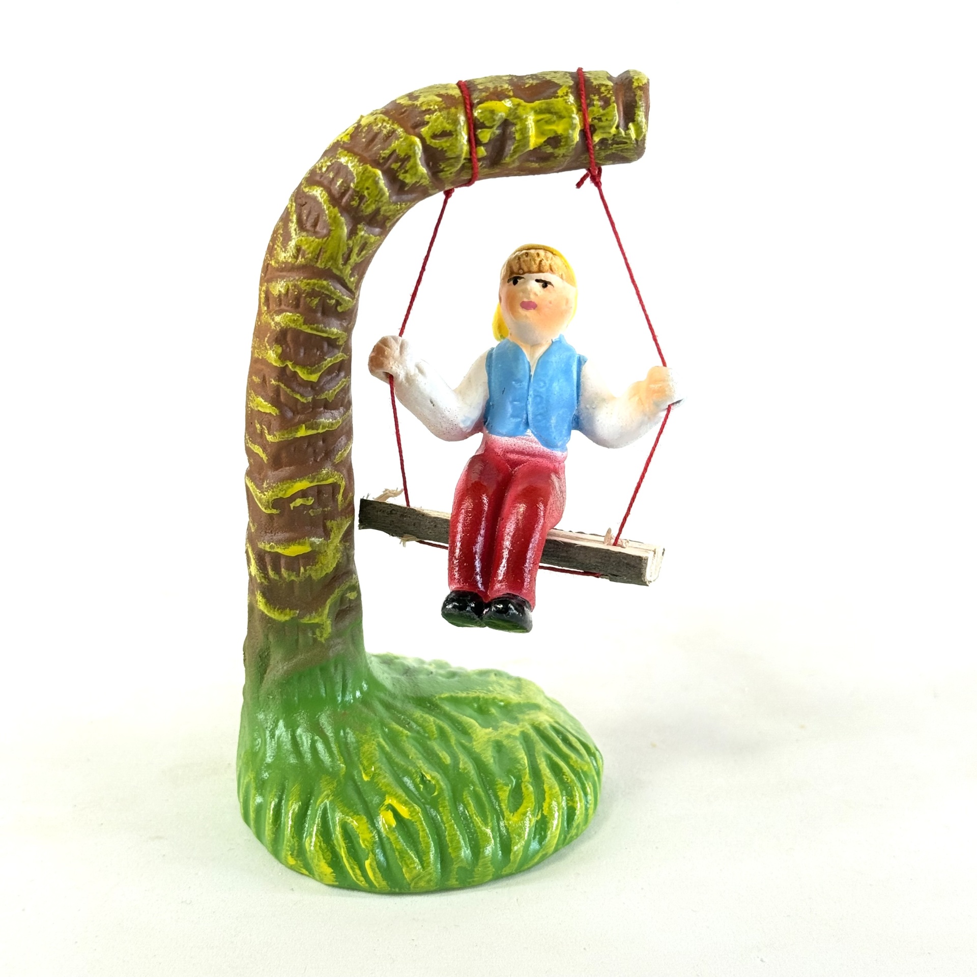 Figura do homem e mulher no baloiço