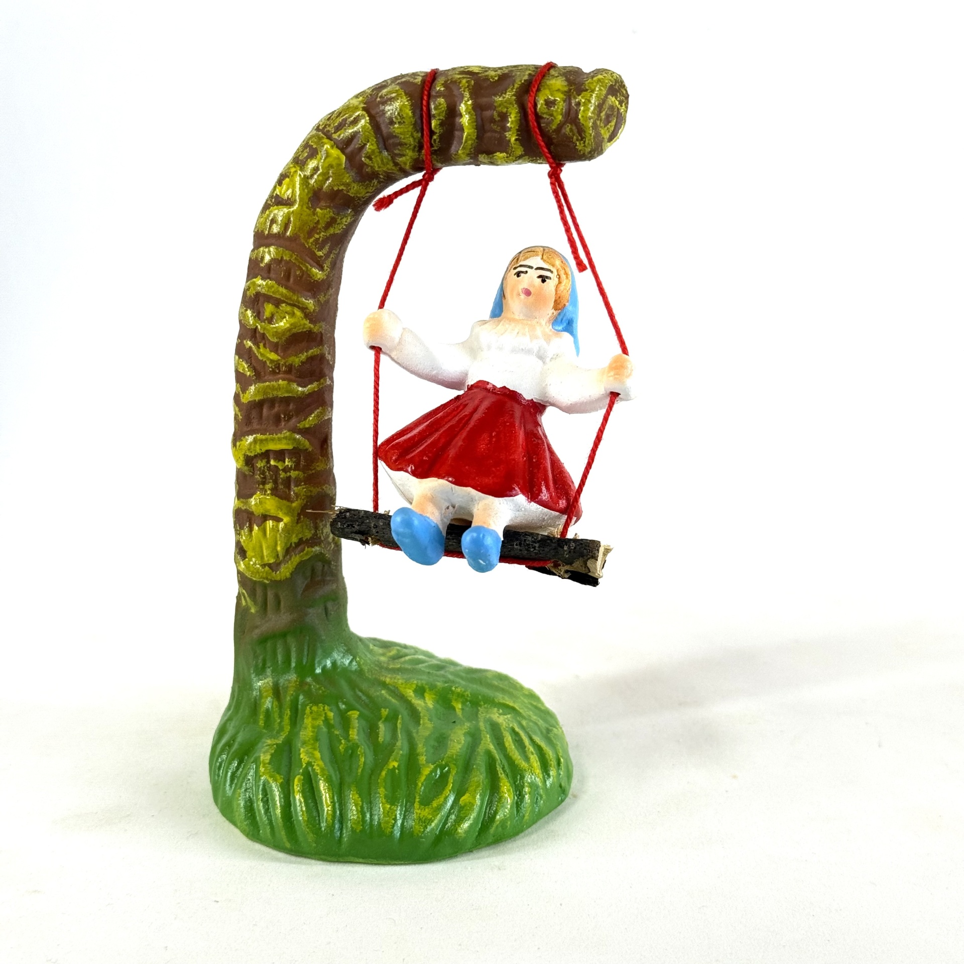 Figura do homem e mulher no baloiço