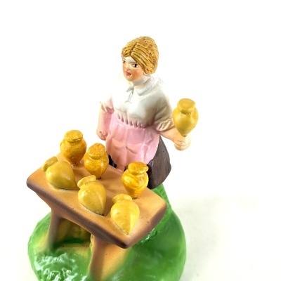 Mulher Vendedora de Piões na Banca