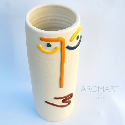 Jar with abstract face