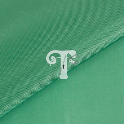 Tecido verde com duas texturas diferentes