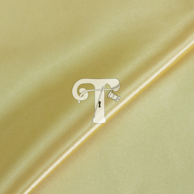 Tecido dourado acetinado e liso esticado