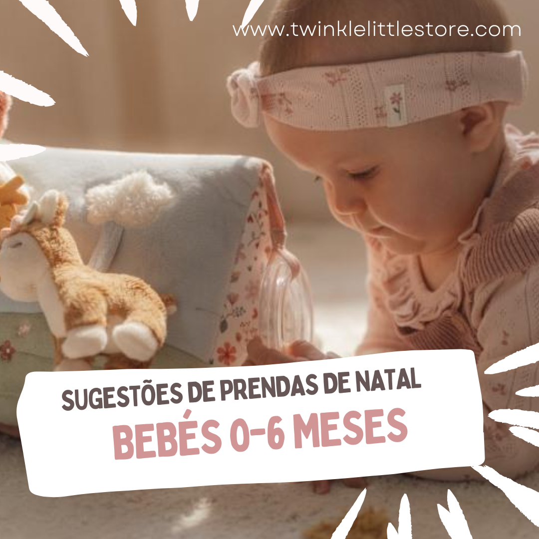 Bebé com faixa rosa e roupa rosa a olhar para brinquedo de pelúcia com girafa