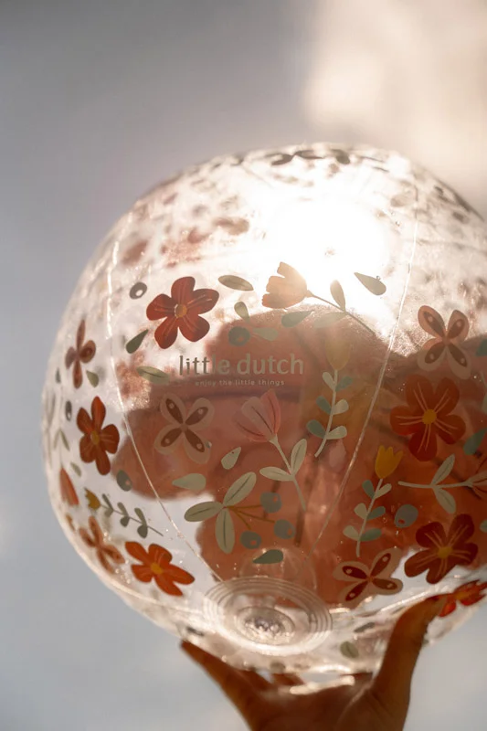 Brinquedo inflável transparente com flores coloridas e texto little dutch