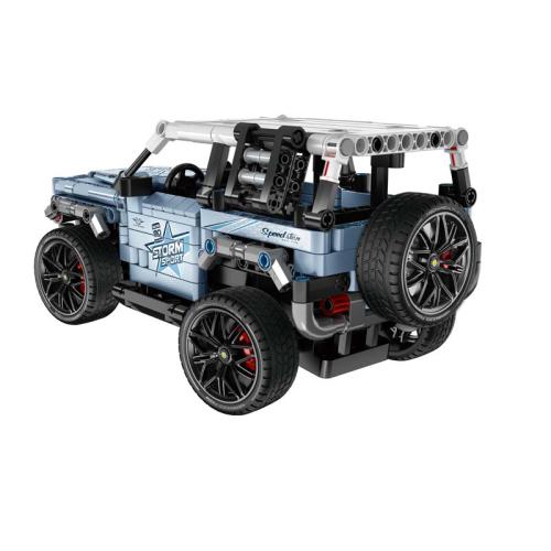 Modelo de carrinha em blocos tipo Lego azul com rodas grandes e texto STORM