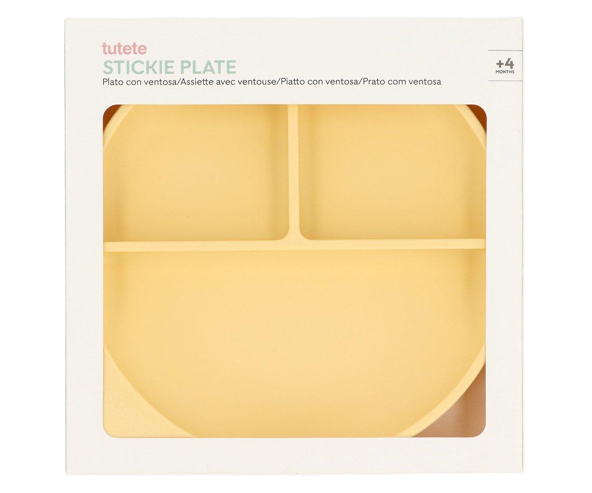 Prato amarelo de silicone com ventosas, dividido em três compartimentos, embalado em caixa branca.